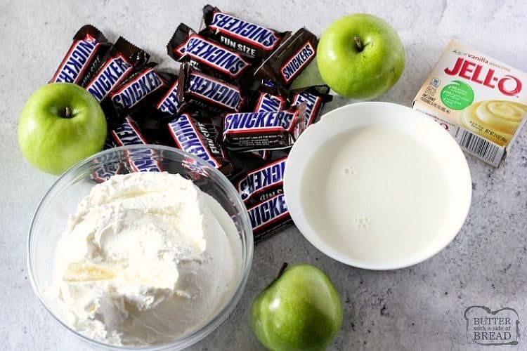 Ingredients for snickers salad. Cool whip, apples, pudding, milk and snickers