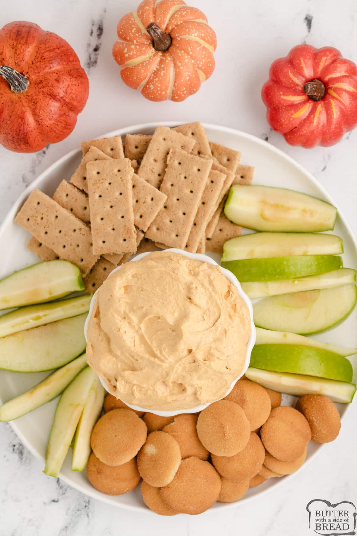 Pumpkin dip with sliced apples, graham crackers and Nilla wafers
