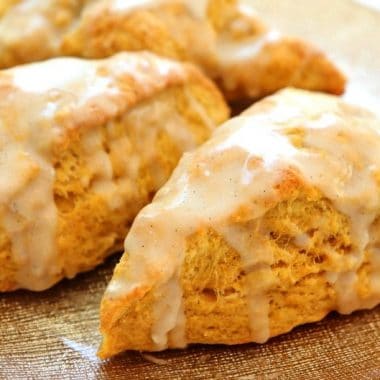 Easy Pumpkin Scones recipe made with pumpkin, cinnamon, brown sugar and butter. Soft & sweet pumpkin scones that are perfect for Fall.