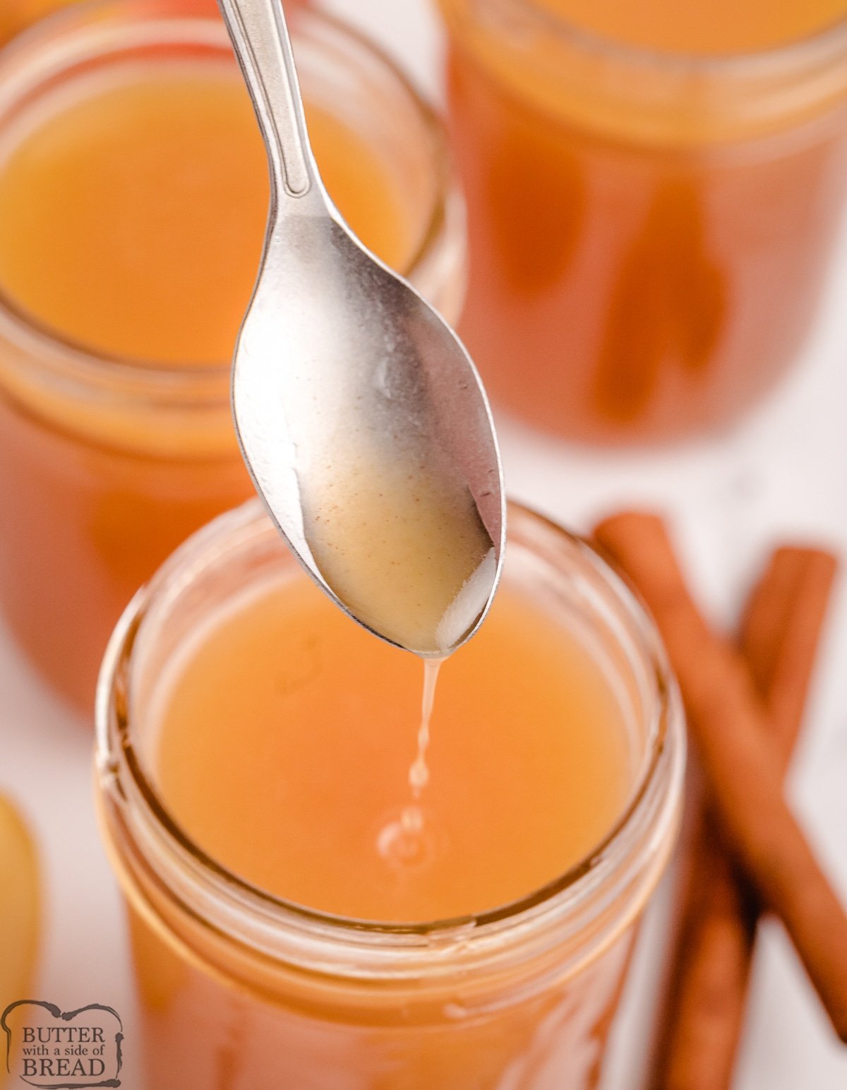 spoonful of apple cider syrup from a jar