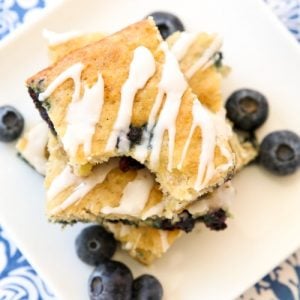 Glazed Blueberry Banana Bars are a simple & delicious ripe banana recipe that’s even better than banana bread! Great for breakfast, lunch, snacking, and it even makes a great dessert!