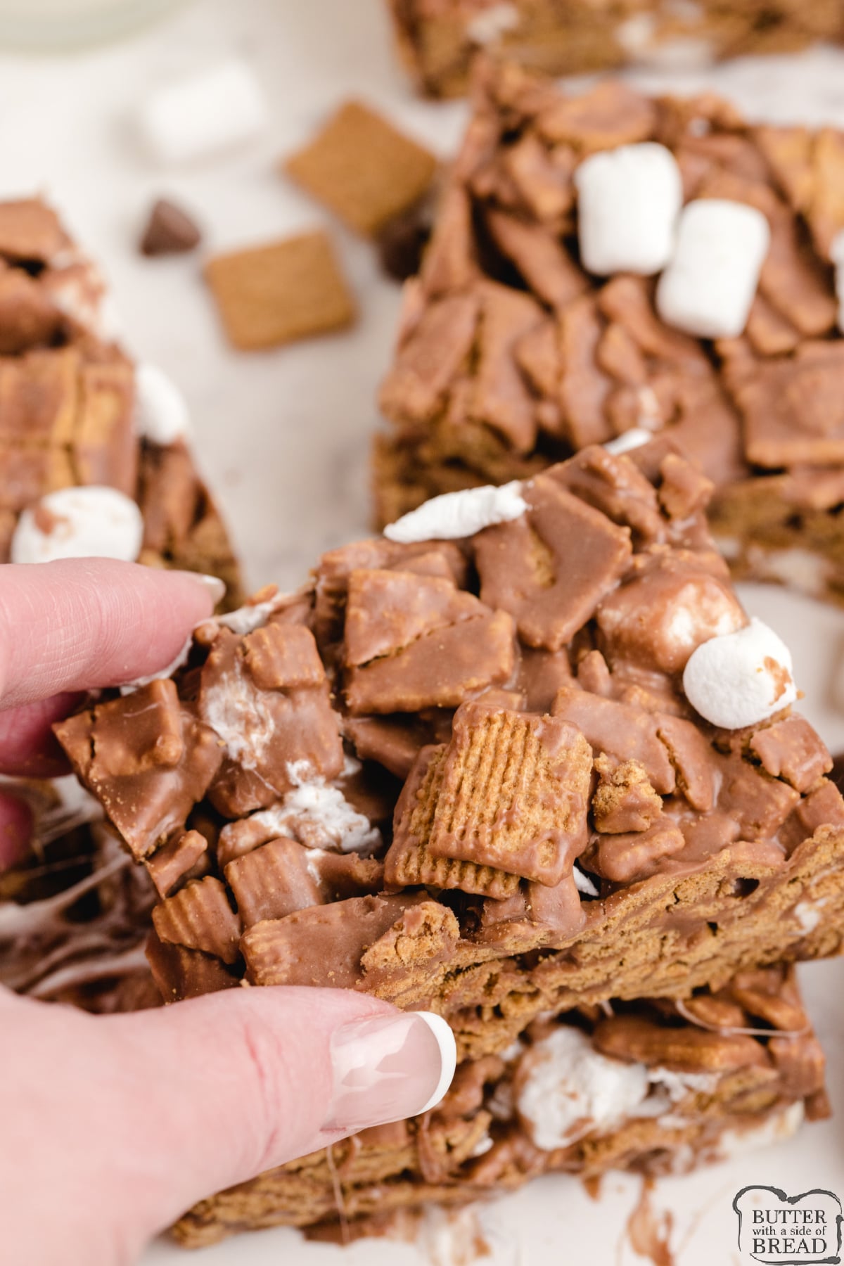 No Bake S'mores Bars are made with Golden Grahams, melted chocolate and marshmallows. This delicious no bake dessert recipe comes together in just a few minutes and tastes just like s'mores, without the mess or the campfire!