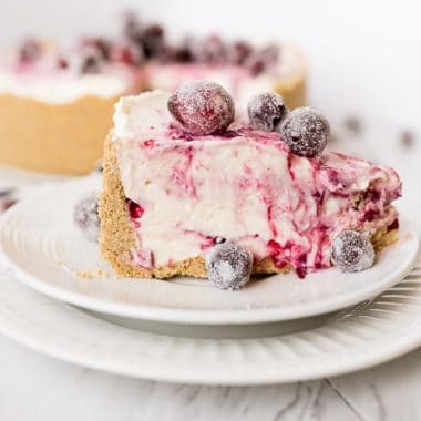 slice of no bake cheesecake with cranberry swirl