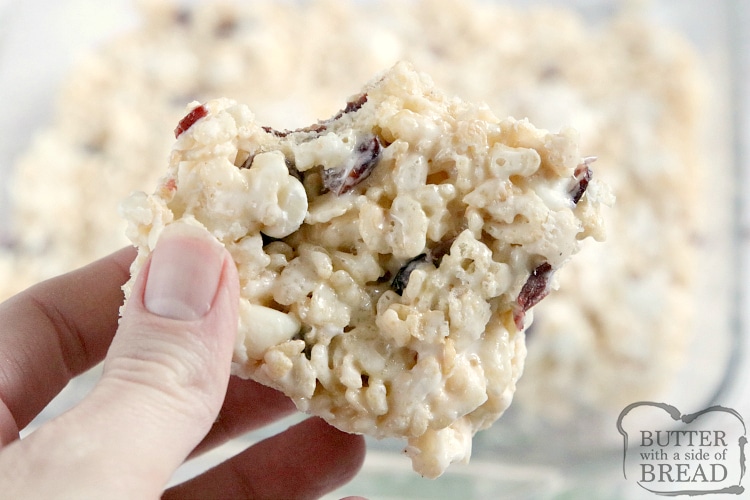 White Chocolate Cranberry Rice Krispie Treats are full of marshmallows, dried cranberries and white chocolate chips. This rice krispie treat recipe is topped with a simple, spiced vanilla glaze to make them even more delicious!
