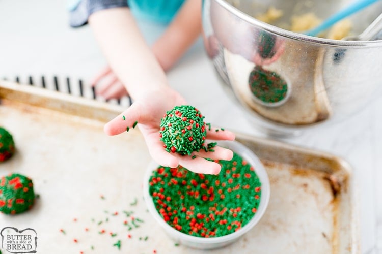 sugar cookie dough covered in green and red sprinkles
