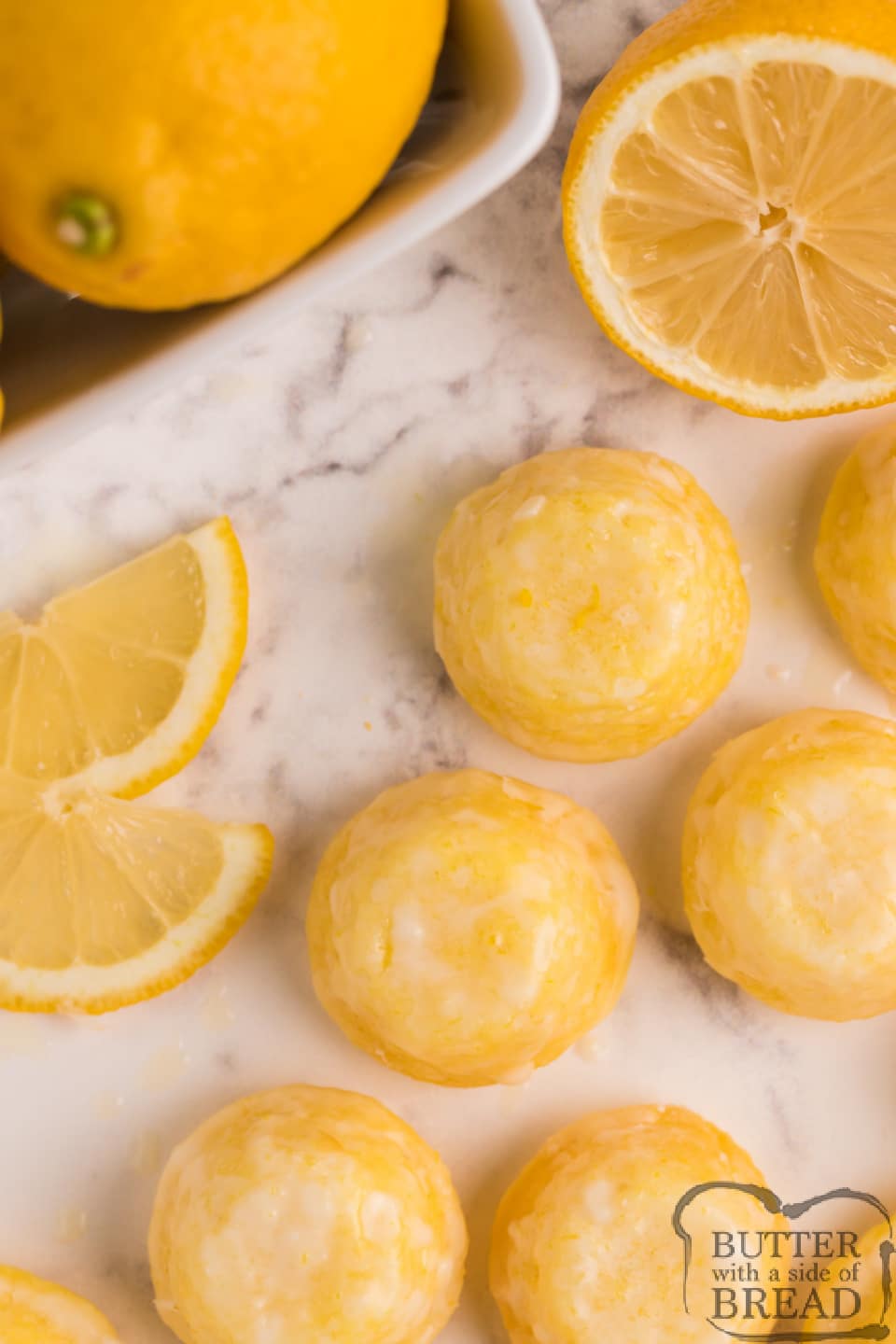 Mini Lemon Drop Cupcakes are delicious bite-sized treats that start with a lemon cake mix! The easy lemon glaze soaks into the inverted mini cupcakes and is a simple, incredibly delicious lemon cake mix recipe!