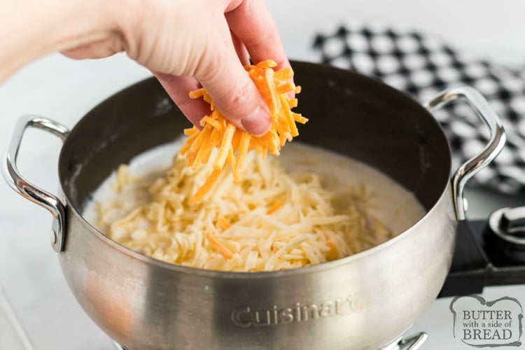 Adding cheese to make fondue recipe