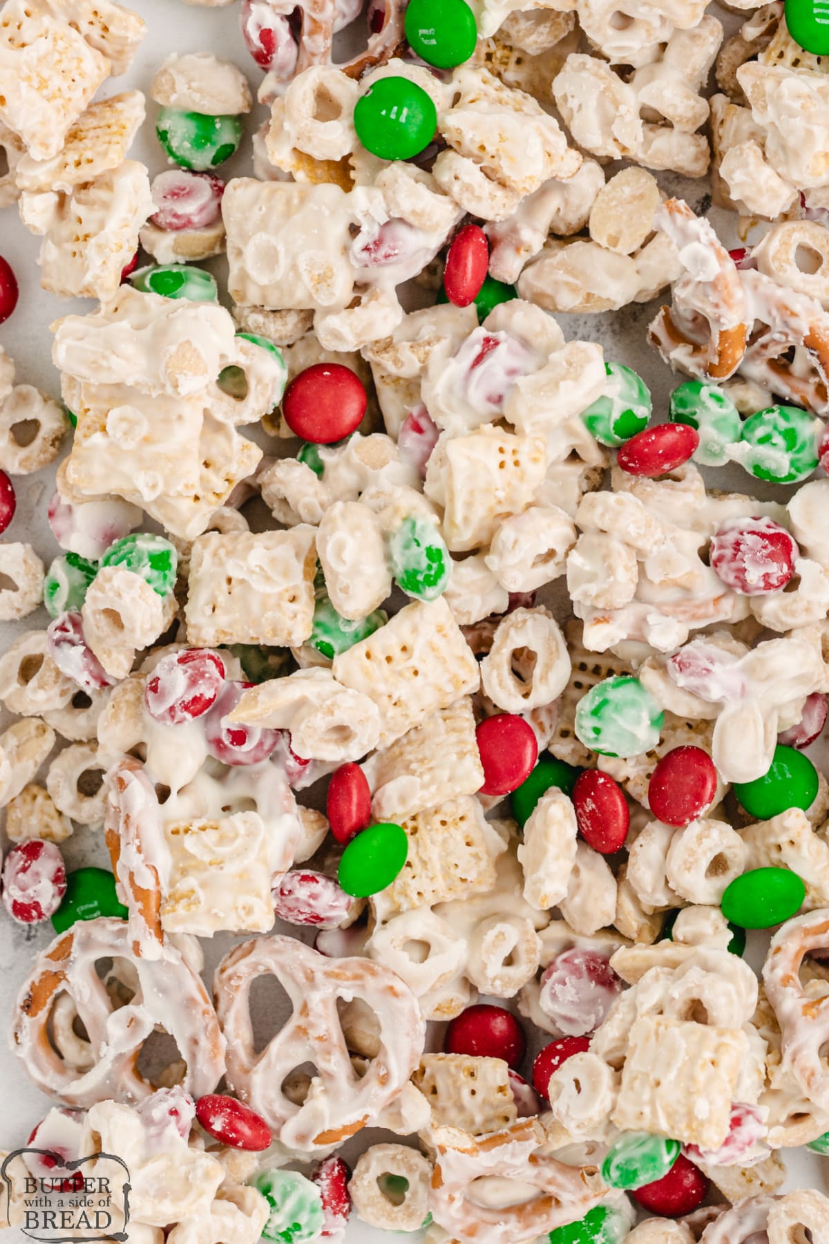 White Chocolate Chex Mix is made with cereal, pretzels, peanuts and M&Ms all coated in white chocolate. This easy white chocolate chex mix recipe is salty and sweet and comes together in less than 5 minutes!