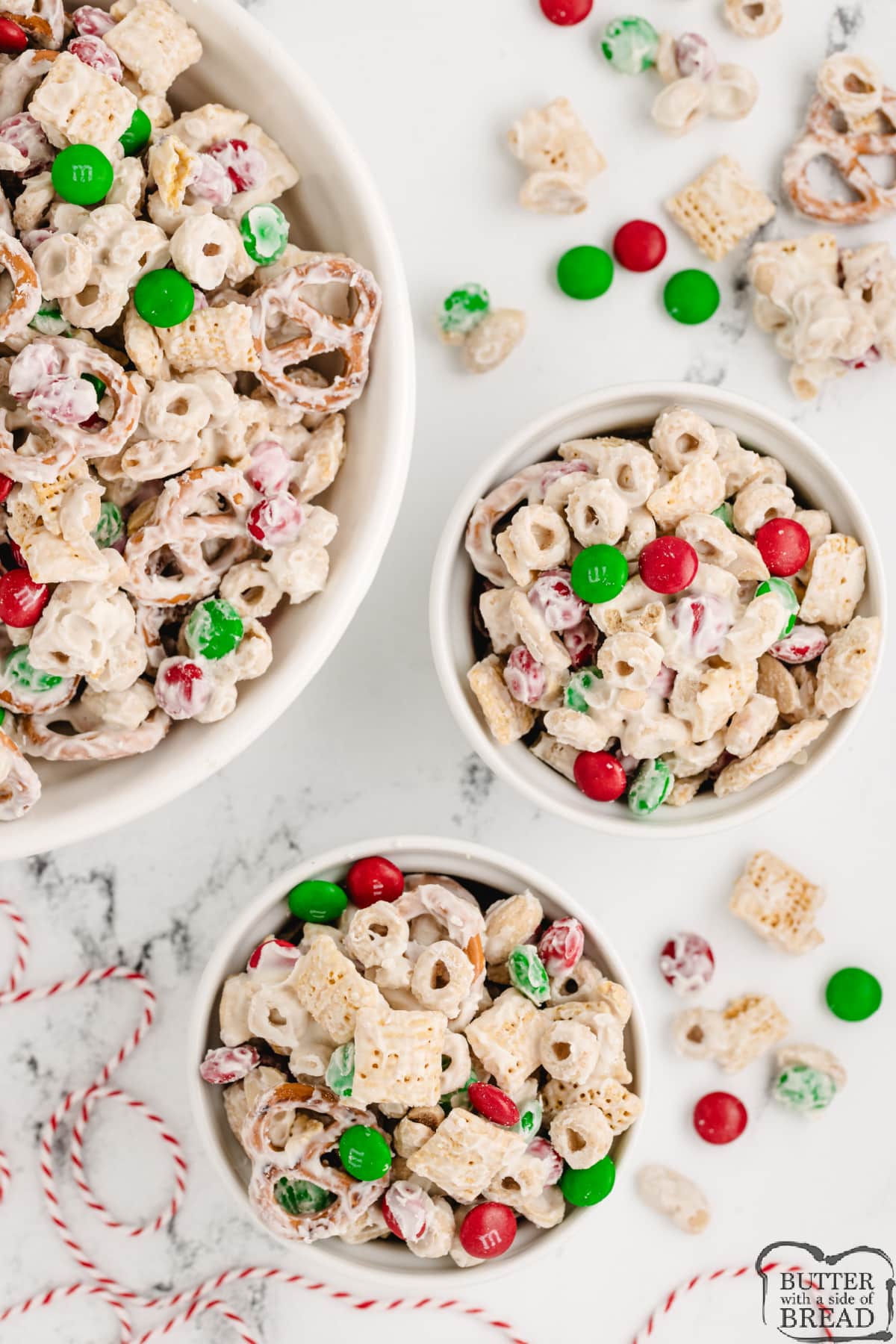 Servings of holiday party mix made with chex cereal, M&Ms and white chocolate. 