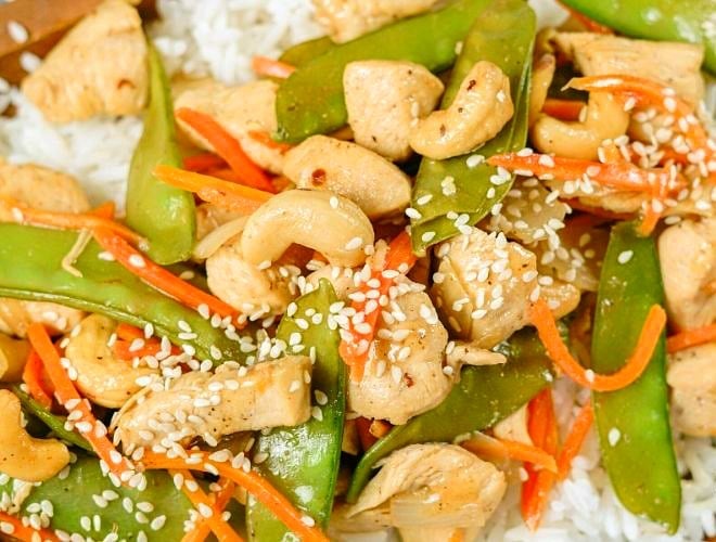 Cashew Chicken Stir Fry is a simple 30 minute meal made with tender chicken & veggies in a flavorful Asian sauce! Stay home, save your money and make up this easy homemade Cashew Chicken Recipe!