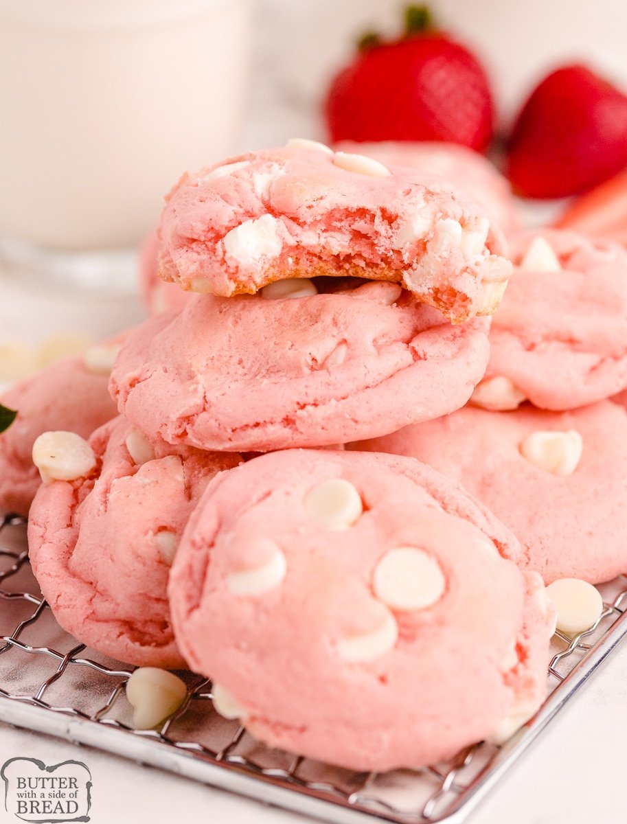 soft chewy pink cake mix cookie with a bite out of it