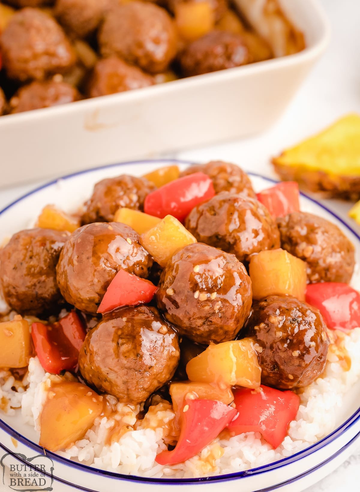 plate of teriyaki meatballs served on top of steamed rice