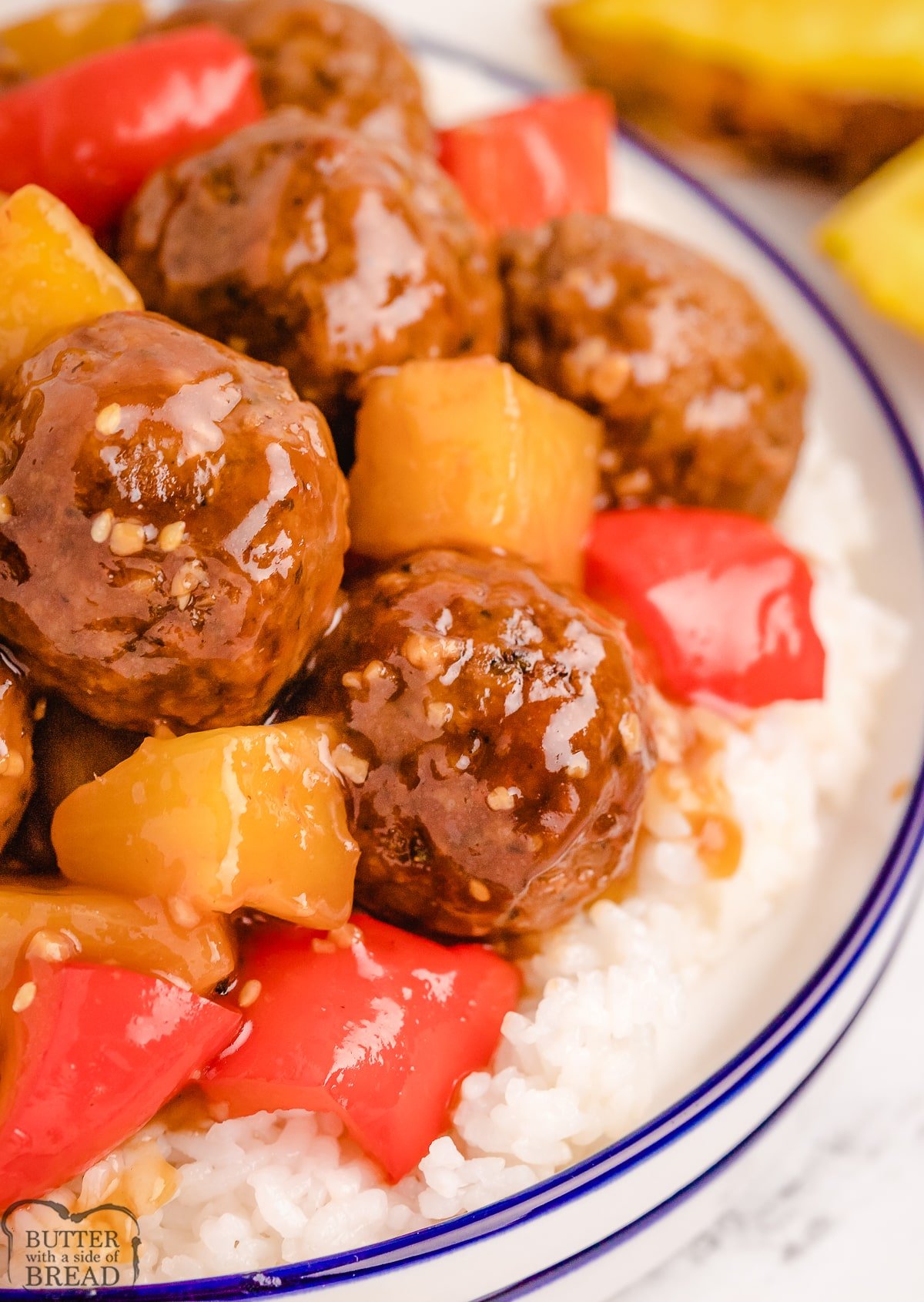 plateful of meatballs with pineapple and pepper strips