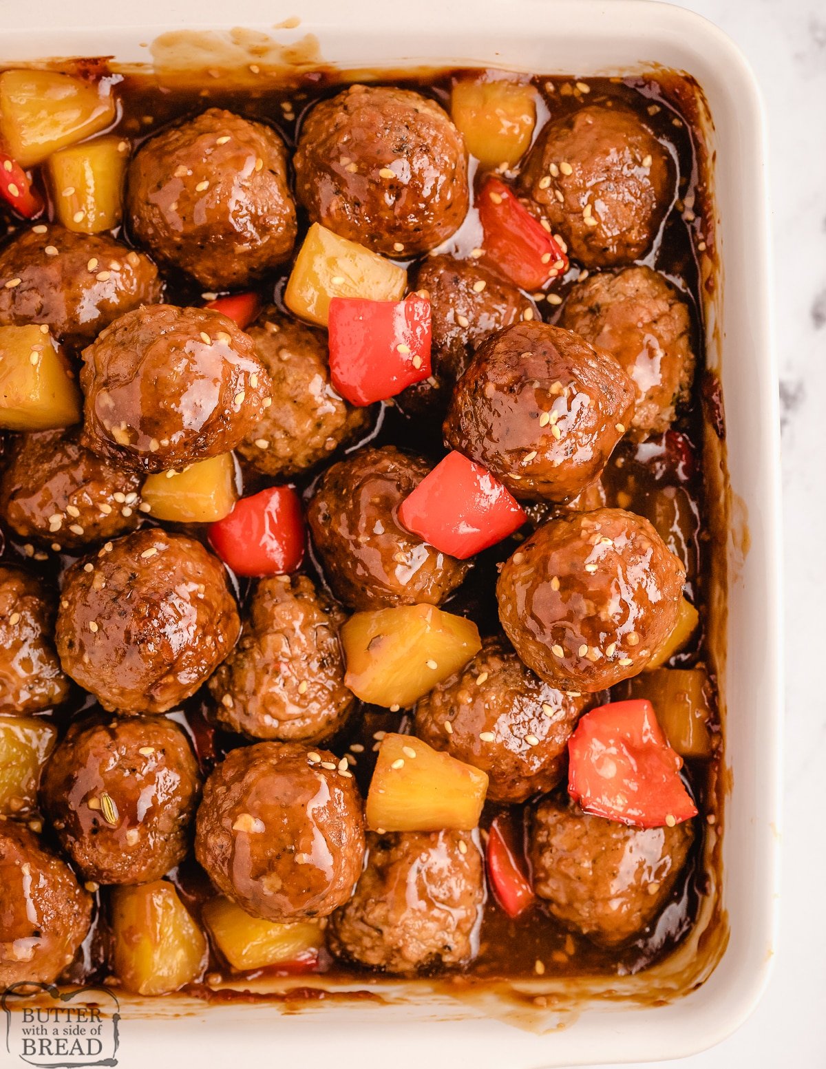 tray of pineapple teriyaki meatballs with bell peppers