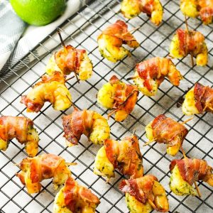 Bacon Wrapped Shrimp is a simple appetizer that only takes 6 ingredients & minutes to cook. This bacon wrapped shrimp recipe is a delicious combination of tangy lime & savory shrimp and bacon.