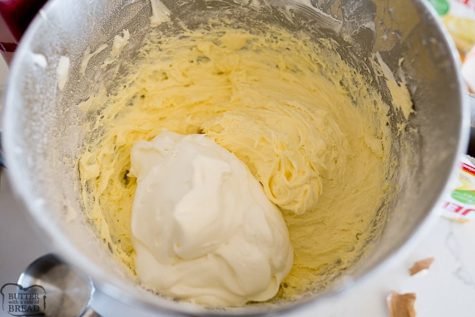 whipped cream being added to the cream cheese mixture