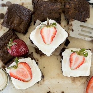 brownies with cream cheese frosting and strawberries