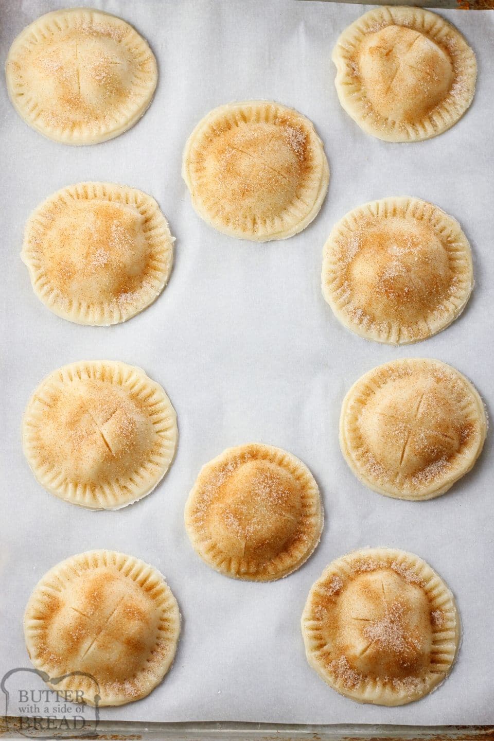mini pies on a parchment lined baking sheet