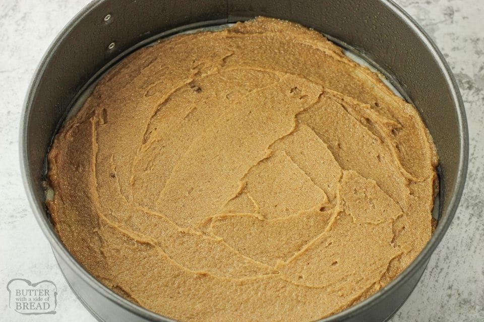 brown sugar butter spread in the bottom of a 8 inch springform pan