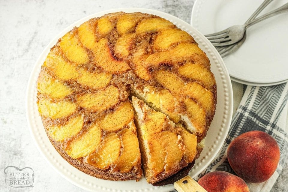 peach upside down cake with a slice being removed