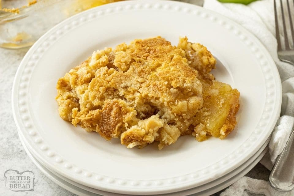 piece of apple dump cake on a white plate