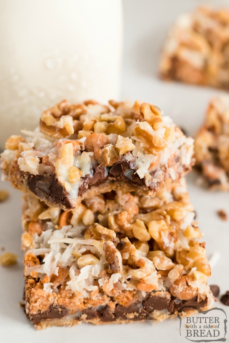 7 Layer Magic Cookie Bars made with graham cracker crumbs, chocolate chips, butterscotch chips, coconut, walnuts and sweetened condensed milk. 7 Layer Bars are a favorite holiday treat that everyone loves!