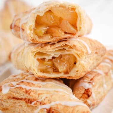 puff pastry apple turnovers with almond glaze on top