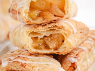 puff pastry apple turnovers with almond glaze on top