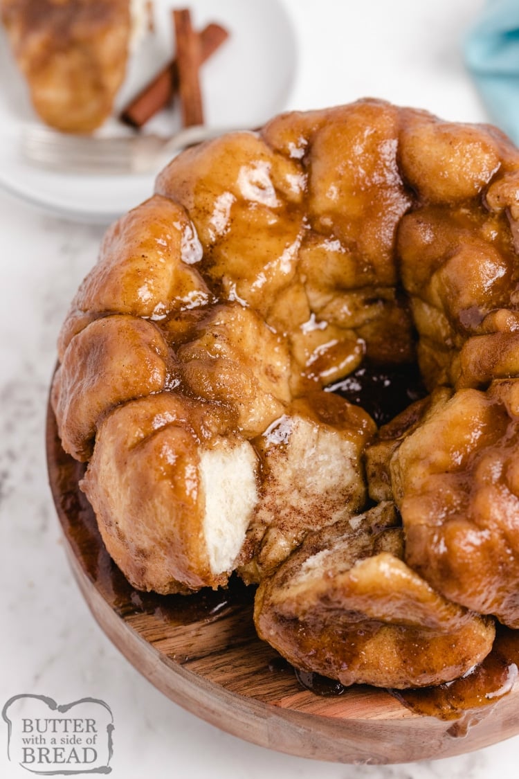 Cream Cheese Stuffed Monkey Bread are warm, gooey cinnamon rolls made with frozen rolls that are filled with cream cheese and coated in brown sugar, butter and cinnamon sugar. Only 5 ingredients to make delicious cinnamon roll monkey bread! 