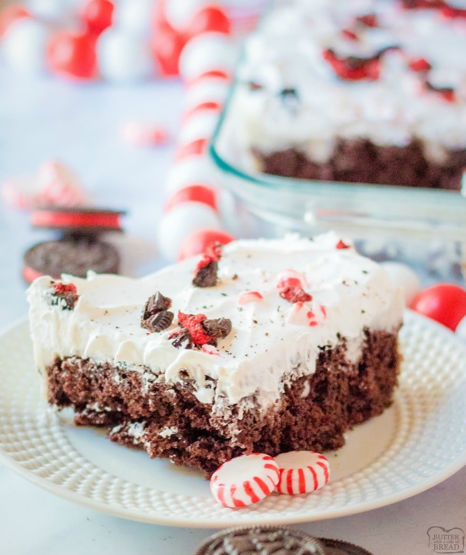 Peppermint Oreo Poke Cake uses a cake mix, cookies & cream pudding, whipped cream, Oreos & peppermint candies for a deliciously festive holiday cake! Easy Christmas cake recipe with peppermint cookie flavors.