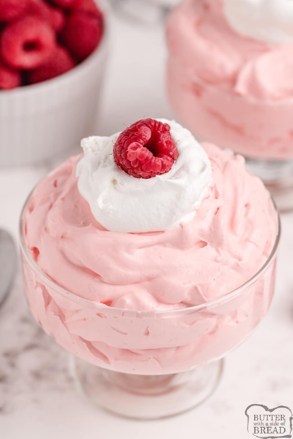 Creamy Raspberry Jello made with just 3 ingredients! Easy Jello recipe made with jello, vanilla pudding and whipped topping for a simple and delicious dessert.