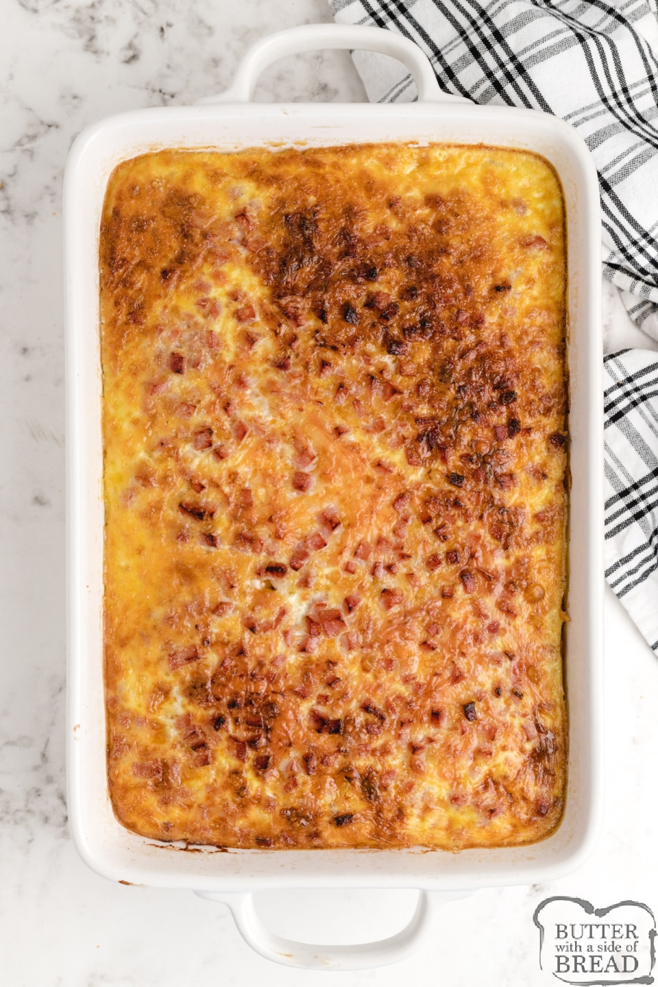 Hash Brown Breakfast Casserole made with a hash brown patty crust, ham, swiss cheese, cheddar cheese and eggs and milk. Only a few minutes of preparation for this easy breakfast casserole recipe!