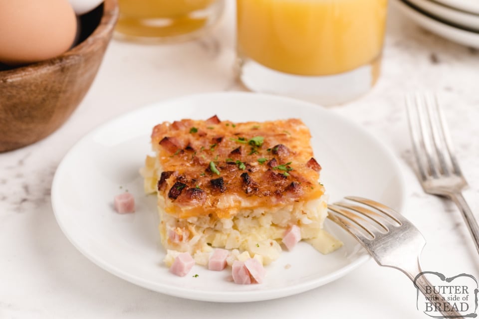 Breakfast casserole made with eggs, cheese, ham and a hash brown crust