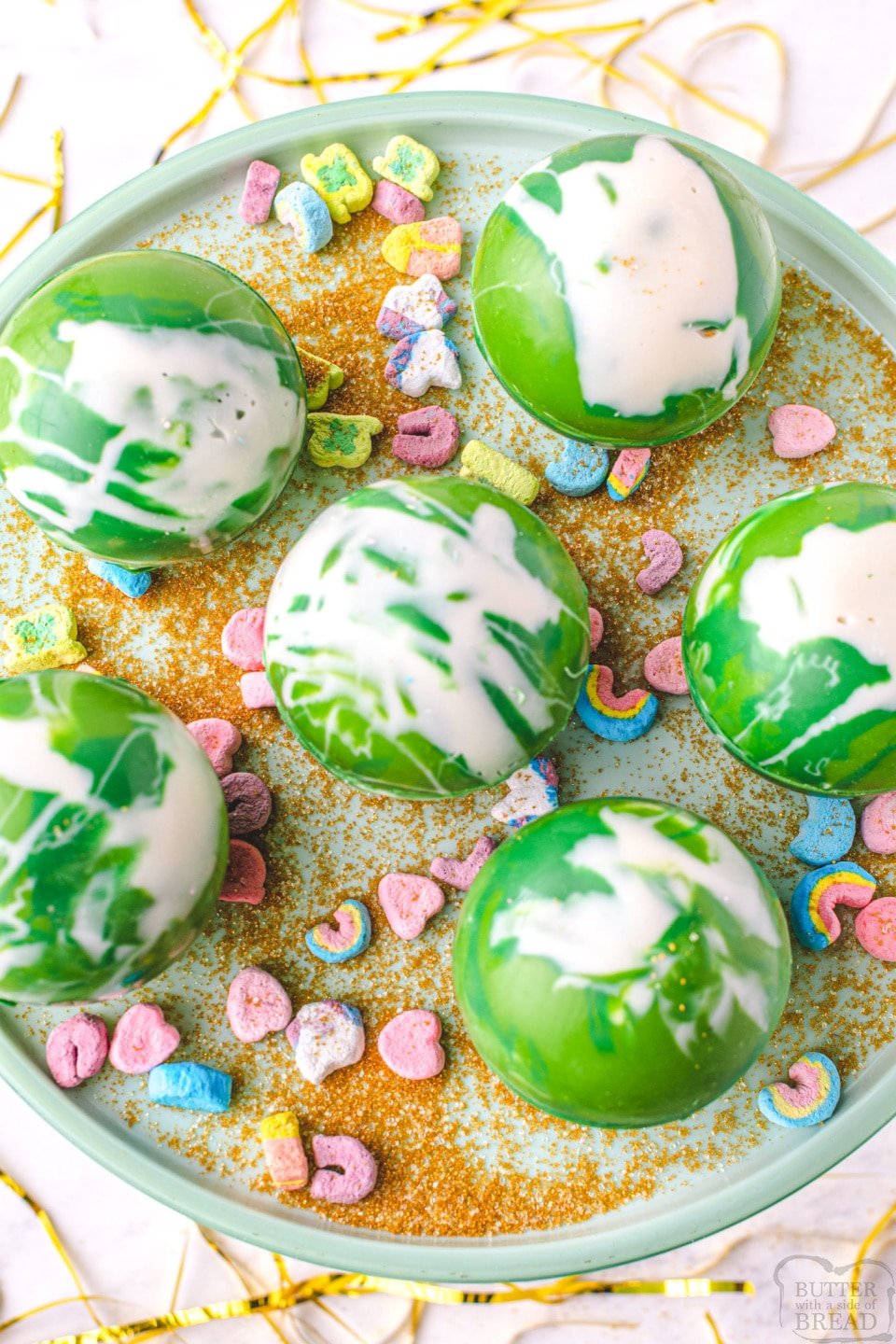 Festive St. Patrick's Day Hot Chocolate Bombs with Lucky Charms marshmallows