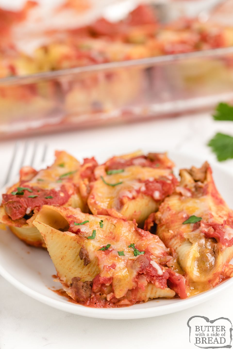 Taco Stuffed Pasta Shells made with a few simple ingredients for an easy dinner recipe that the whole family will love. Pasta shells stuffed with seasoned ground beef and beans and then topped with cheese and salsa.