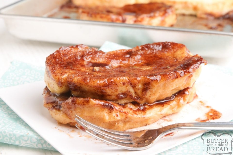 Baked Cinnamon French Toast is a simple way to make french toast for the whole family at once! Thick slices of french bread soaked in an egg mixture and then baked in a buttery, cinnamon and brown sugar mixture. 