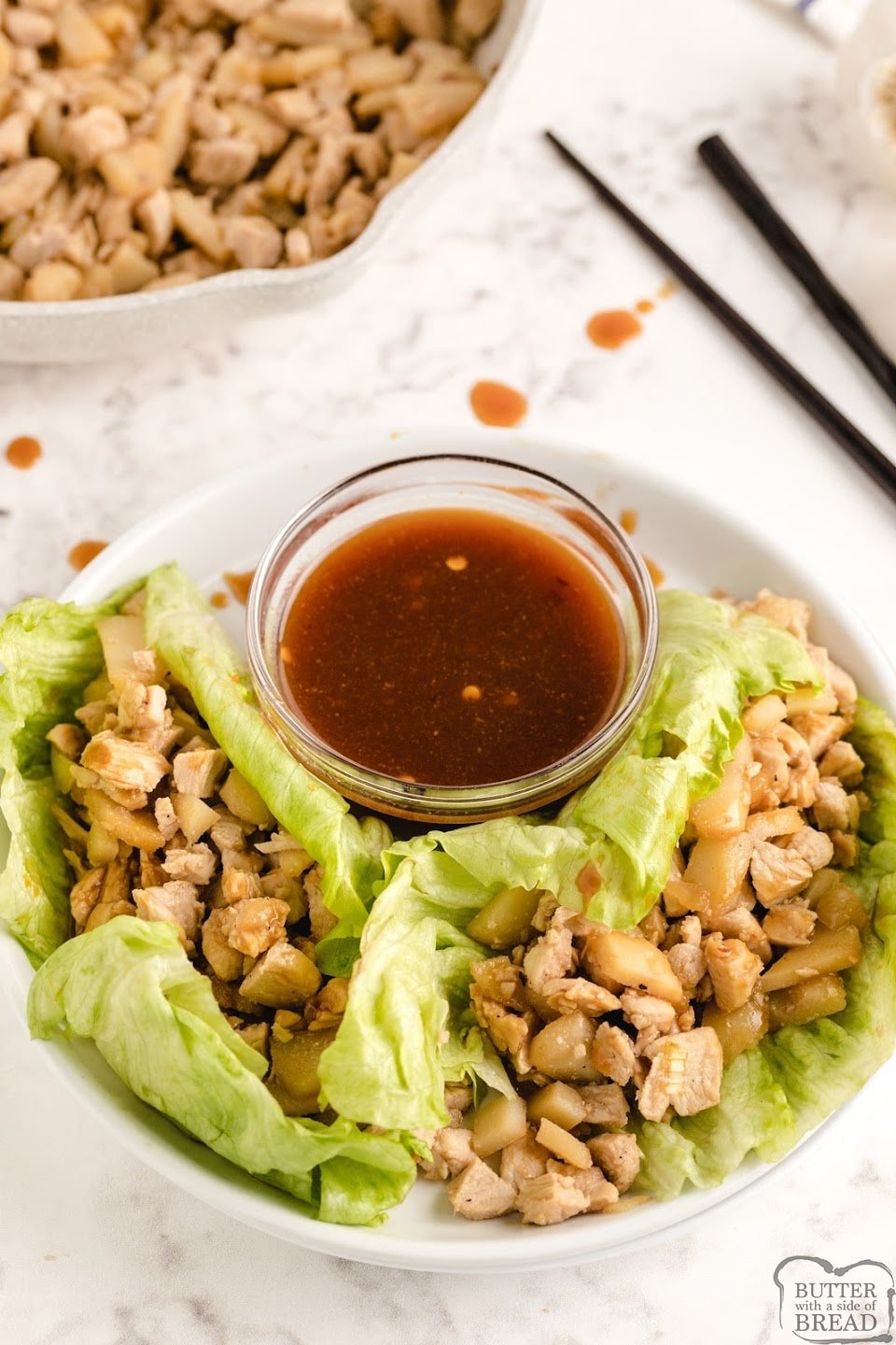 Chicken Lettuce Wraps made with chicken, water chestnuts, onion and garlic in a leaf of lettuce and then dipped in a delicious homemade Asian sauce. Easy chicken lettuce wrap recipe that is perfect as a low-carb appetizer or main dish. 
