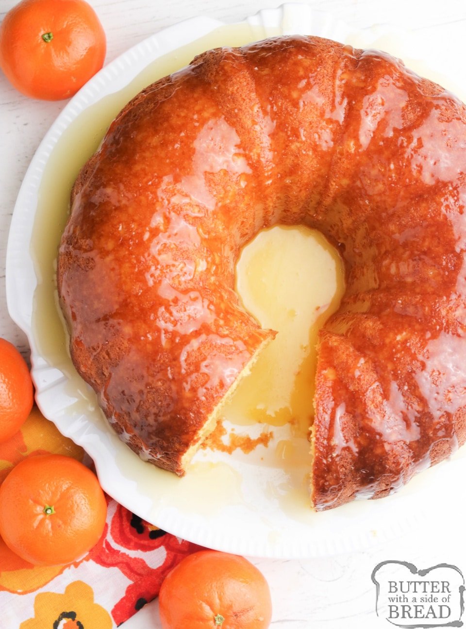 Orange Juice Bundt Cake made with a cake mix, orange juice and a few other basic ingredients. Topped with a buttery orange glaze, this delicious orange juice cake recipe is absolutely decadent!