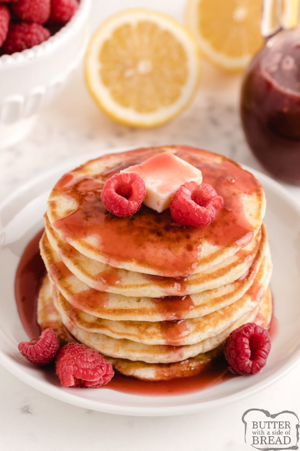 Lemon Pancakes with Raspberry Syrup are light and fluffy with a subtle lemon flavor. Top with a simple two-ingredient raspberry syrup made with frozen raspberries for a delicious pancake breakfast.