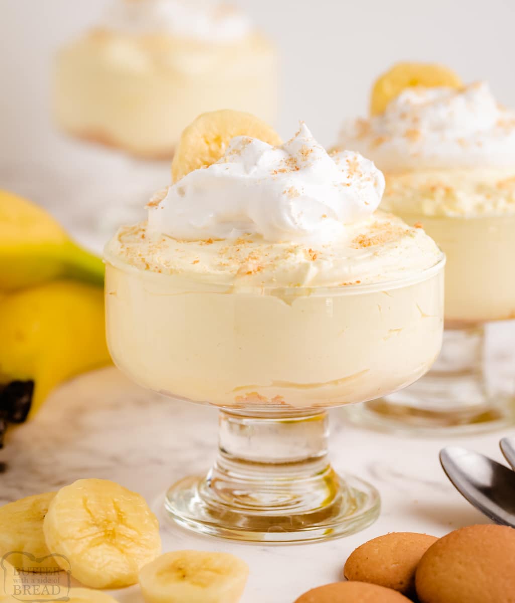 banana cheesecake in a small glass bowl with sliced bananas