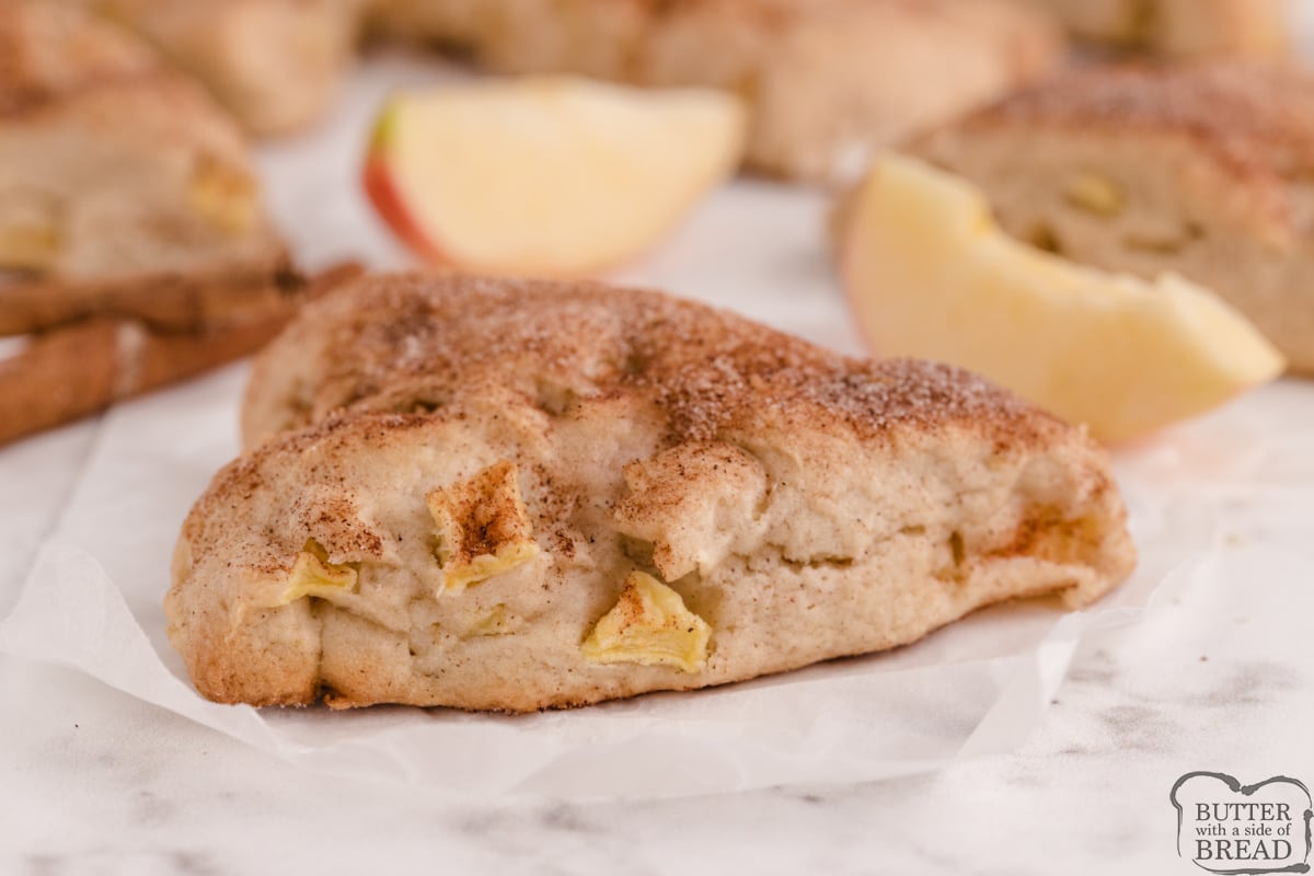 Apple Cinnamon Scones made with fresh apples and topped with cinnamon and sugar. Delicious homemade scone recipe that is great for breakfast or a sweet treat! 
