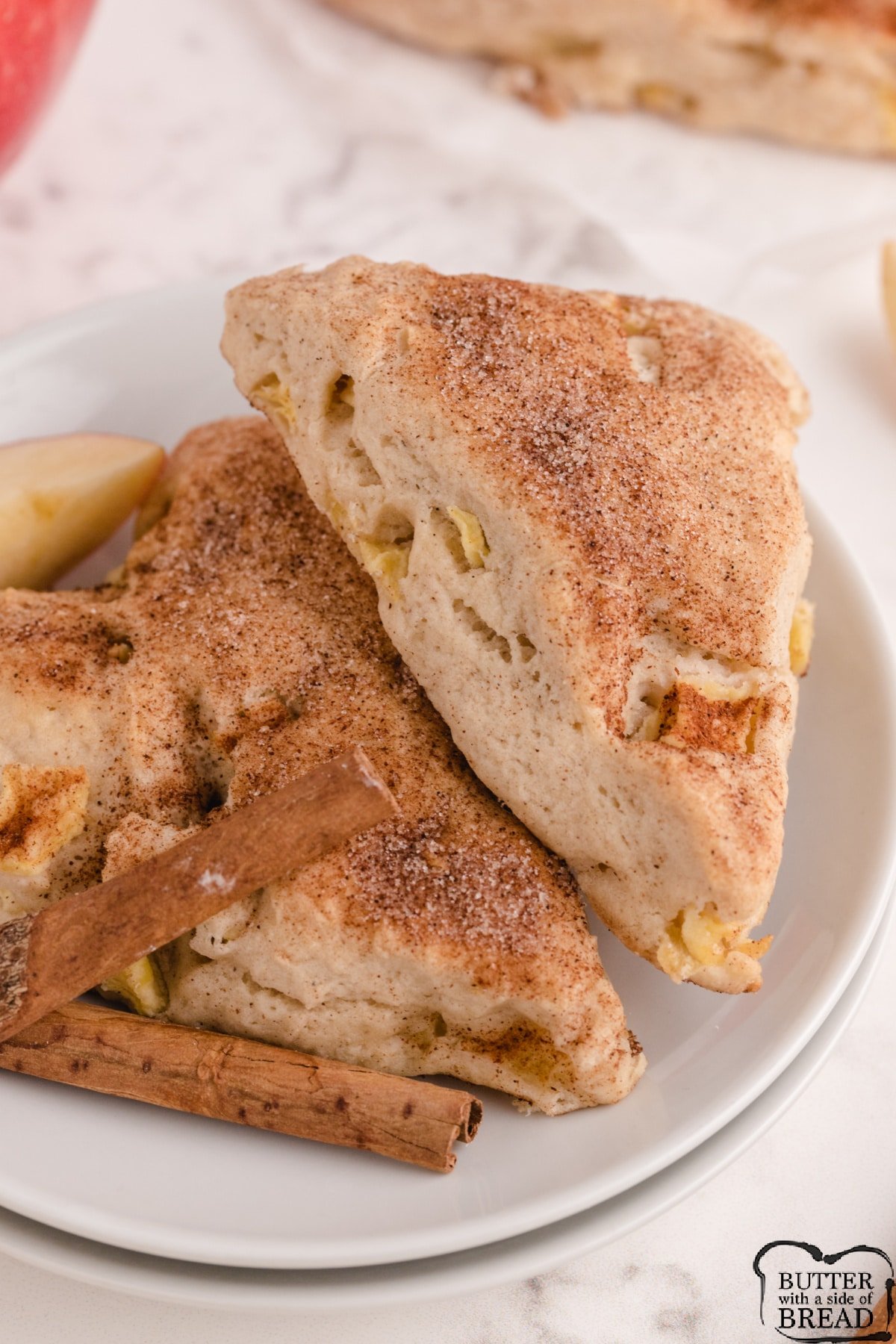 Apple Cinnamon Scones made with fresh apples and topped with cinnamon and sugar. Delicious homemade scone recipe that is great for breakfast or a sweet treat! 