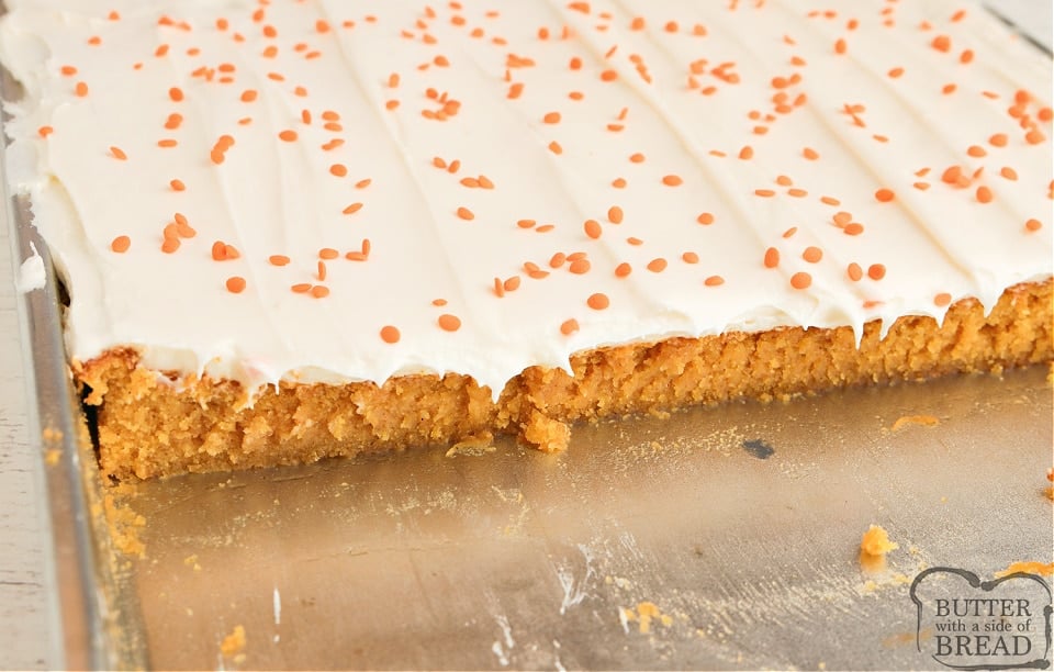 Pan of pumpkin bars topped with cream cheese frosting