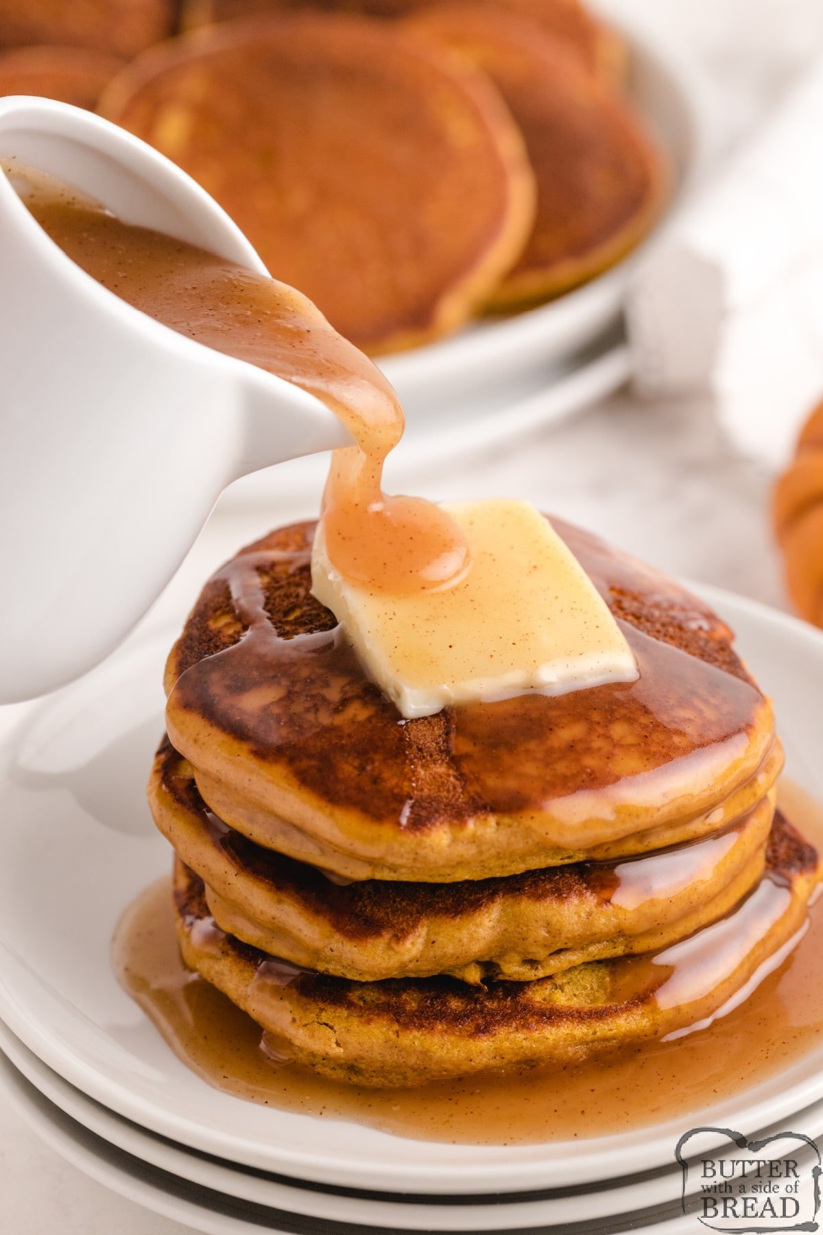 Pumpkin Pancakes with Apple Cider Syrup begin with a pancake mix for an easy fall breakfast. The pancakes are full of pumpkin flavor and the homemade syrup is absolutely incredible! 