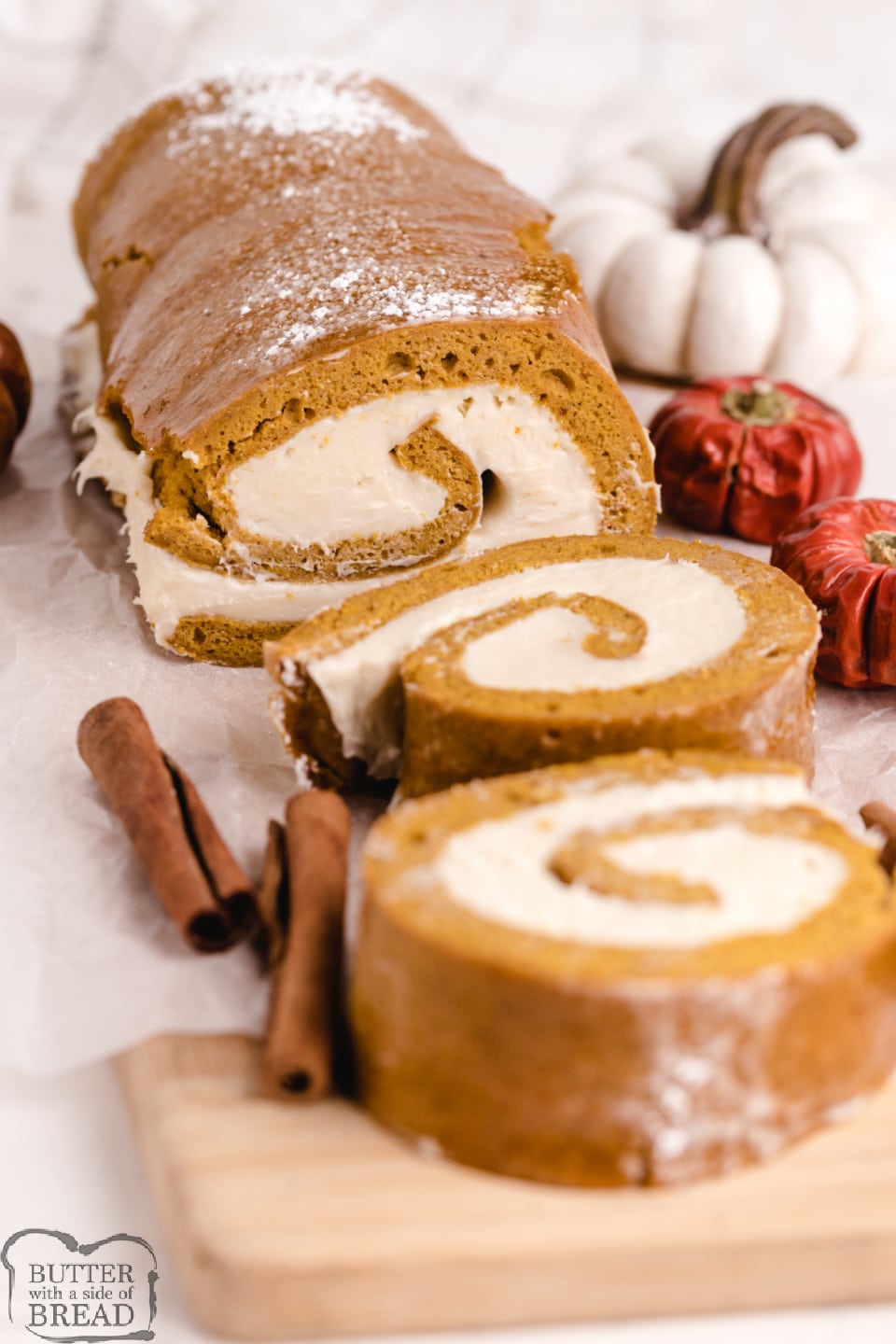 Pumpkin Roll recipe that turns out perfectly every time! Easy pumpkin cake that is topped with a cream cheese frosting, then rolled up and sliced. 