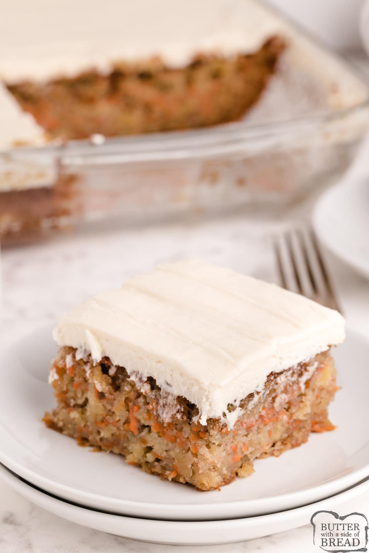 Best Carrot Cake recipe that is moist, delicious and made with crushed pineapple and shredded carrots. The homemade cream cheese frosting pairs perfectly with this carrot cake recipe.