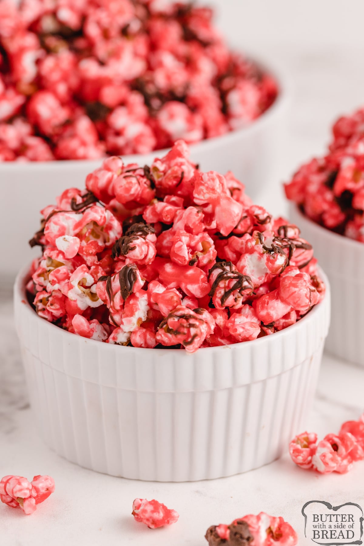 Chocolate Cherry Popcorn is a delicious treat made with cherry Kool-Aid and a melted chocolate drizzle. This popcorn recipe is perfect as a snack or dessert and it is also super easy to make!