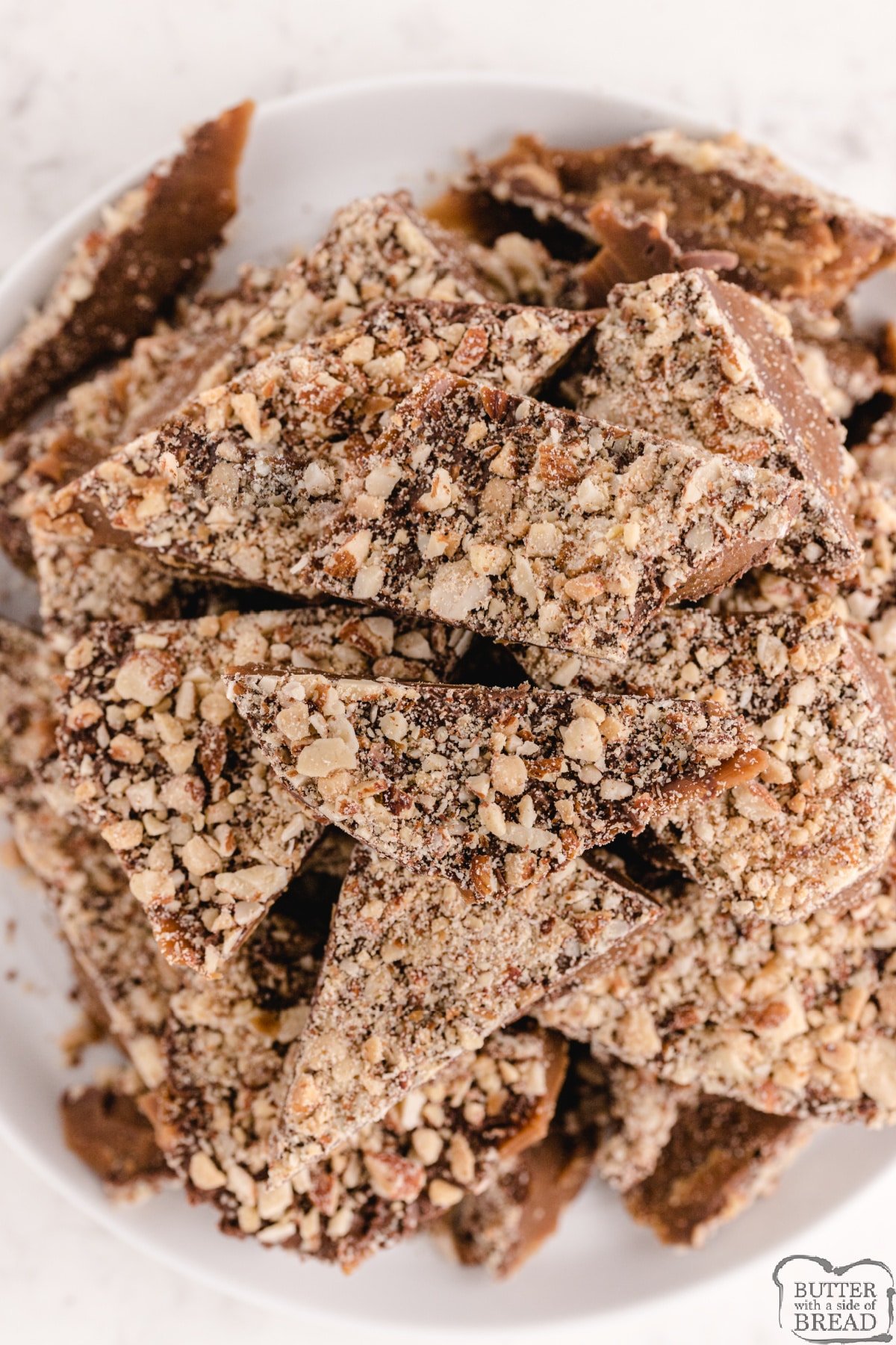 Easy Homemade Almond Roca made with only 4 ingredients! Delicious easy toffee recipe made with almonds, chocolate, butter and sugar that is even better than the store-bought version. 