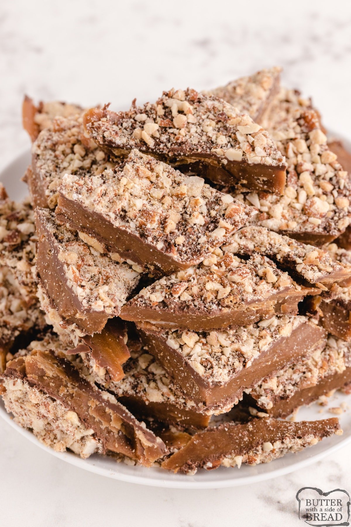 Easy Homemade Almond Roca made with only 4 ingredients! Delicious easy toffee recipe made with almonds, chocolate, butter and sugar that is even better than the store-bought version. 