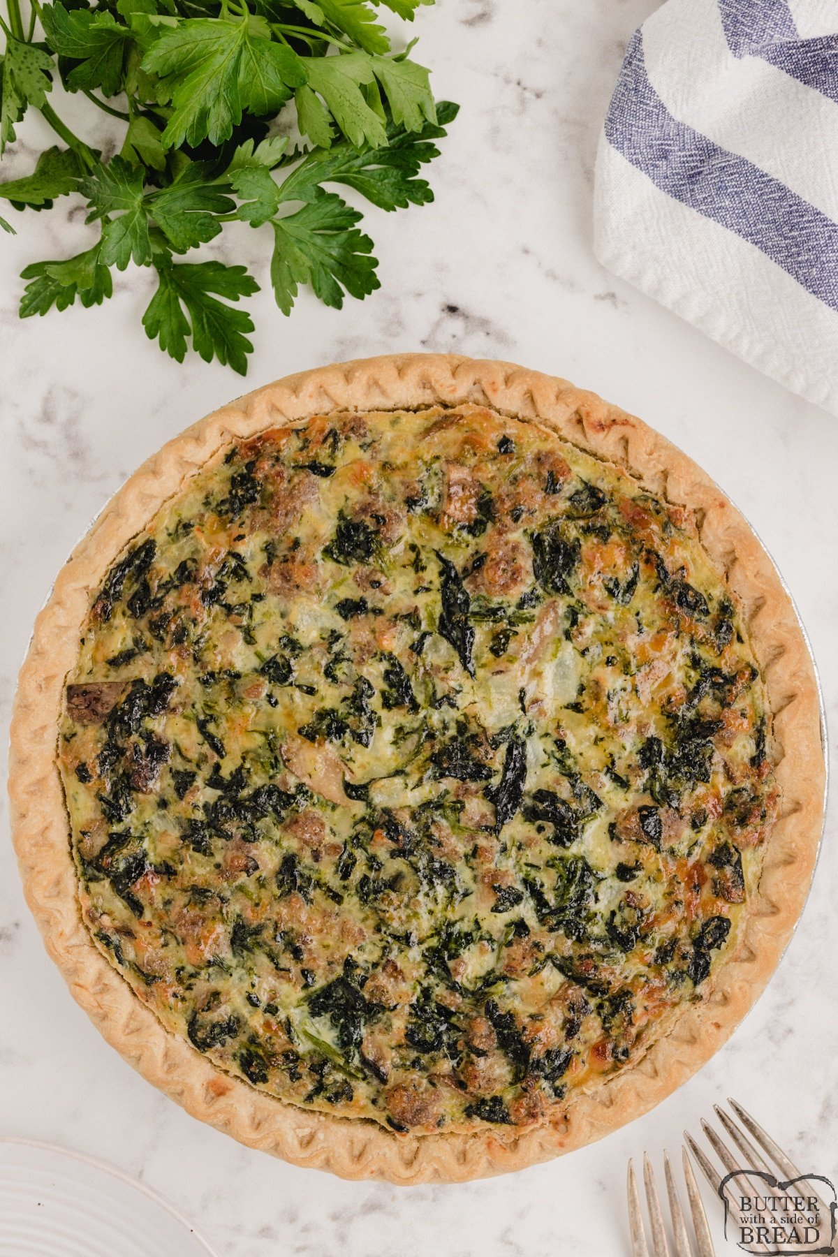 Best Quiche recipe made with spinach, sausage, mushrooms and three kinds of cheese! Easy quiche recipe that is delicious!